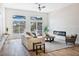 Bright living room featuring a sliding glass door to the outdoor space and a modern fireplace at 4314 Livorno Ave, Las Vegas, NV 89141
