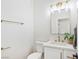 Bright powder room featuring a sink with modern fixtures, offering a clean and stylish design at 4314 Livorno Ave, Las Vegas, NV 89141