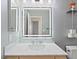 Updated bathroom with large, lighted mirror and modern fixtures at 4323 Pageantry Falls Dr, North Las Vegas, NV 89031