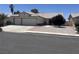 Charming single-story home featuring a three car garage and desert landscaping for low maintenance appeal at 4323 Pageantry Falls Dr, North Las Vegas, NV 89031