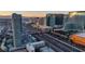 Striking aerial view of the city skyline at sunset, showcasing towering skyscrapers and busy highways at 4525 Dean Martin Dr # 2503, Las Vegas, NV 89103