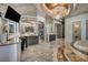 Luxurious primary bathroom with a stunning chandelier, dual sink vanities, a soaking tub, and artistic décor at 4525 Dean Martin Dr # 2503, Las Vegas, NV 89103