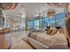 An expansive primary bedroom featuring city views, a large window, and a luxurious round platform bed at 4525 Dean Martin Dr # 2503, Las Vegas, NV 89103