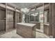 Spacious walk-in closet featuring ample shelving and cabinet space, marble floors, and a modern chandelier at 4525 Dean Martin Dr # 2503, Las Vegas, NV 89103