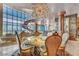 Elegant dining room features a sculptural staircase, floor-to-ceiling windows, and designer lighting at 4525 Dean Martin Dr # 2503, Las Vegas, NV 89103
