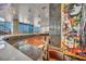 Modern kitchen featuring a curved countertop, copper sink, stainless steel appliances, and city views through expansive windows at 4525 Dean Martin Dr # 2503, Las Vegas, NV 89103