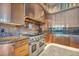 Modern kitchen featuring an industrial range hood and marble countertops at 4525 Dean Martin Dr # 2503, Las Vegas, NV 89103