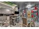 Bright modern kitchen with gray cabinets, marble accents, a bar area, and a unique decorative wall at 4525 Dean Martin Dr # 2503, Las Vegas, NV 89103
