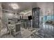 Open living area featuring unique wall decor, bar seating, stainless steel appliances, and outside views at 4525 Dean Martin Dr # 2503, Las Vegas, NV 89103