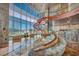 Expansive living area showcases a sculptural staircase, stylish seating, and panoramic city views at 4525 Dean Martin Dr # 2503, Las Vegas, NV 89103