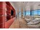 Bright living room features custom built-ins, city views, and neutral couches at 4525 Dean Martin Dr # 2503, Las Vegas, NV 89103
