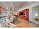 Stunning living room featuring a unique door, red display cases, and neutral couches at 4525 Dean Martin Dr # 2503, Las Vegas, NV 89103