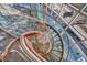 Ornate spiral staircase featuring copper accents and a gorgeous chandelier at 4525 Dean Martin Dr # 2503, Las Vegas, NV 89103