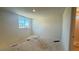 Bright bedroom with a large window and en-suite bathroom, awaiting final touches at 4684 Parkarbor Ave, Las Vegas, NV 89141