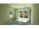 Bright bedroom featuring sliding glass doors to the backyard, offering natural light at 4684 Parkarbor Ave, Las Vegas, NV 89141
