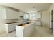 Spacious kitchen with white cabinets and island, ready for countertops and appliances at 4684 Parkarbor Ave, Las Vegas, NV 89141