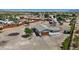 Aerial view of the home showing the exterior and surrounding property, including the garage and desert landscape at 4981 E Pawnee Pl, Pahrump, NV 89061