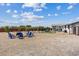 Expansive backyard featuring a seating area, volleyball net, and green patch for a hammock at 4981 E Pawnee Pl, Pahrump, NV 89061