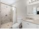Bathroom featuring a stone-look tiled shower with glass door and modern vanity at 4981 E Pawnee Pl, Pahrump, NV 89061