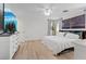 Bright bedroom features a ceiling fan, light walls, and a cozy bed at 4981 E Pawnee Pl, Pahrump, NV 89061