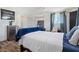 Bedroom boasts wood floors, ample natural light, and a mini-split air conditioner at 4981 E Pawnee Pl, Pahrump, NV 89061