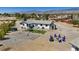 Expansive backyard on a home featuring a fire pit, hammock and space for activities, against a mountain backdrop at 4981 E Pawnee Pl, Pahrump, NV 89061