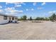 Exterior view showcasing the front of the home with desert landscaping at 4981 E Pawnee Pl, Pahrump, NV 89061