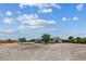 Exterior view showcasing the front of the home and ample desert landscaping at 4981 E Pawnee Pl, Pahrump, NV 89061