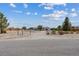 Exterior view of a property with a gate and fenced yard at 4981 E Pawnee Pl, Pahrump, NV 89061