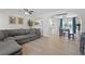 Spacious living room with an open archway to dining and kitchen, perfect for modern living and entertaining at 4981 E Pawnee Pl, Pahrump, NV 89061