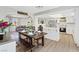 Open concept living space with dining area flowing into the kitchen, perfect for entertaining and modern living at 4981 E Pawnee Pl, Pahrump, NV 89061