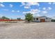 Spacious backyard showcasing the home's exterior with a detached garage at 4981 E Pawnee Pl, Pahrump, NV 89061