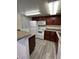 Efficient kitchen with granite countertops, wood cabinets, and white appliances at 5251 Indian River Dr # 271, Las Vegas, NV 89103