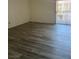 Inviting living room featuring modern floors and natural light from the sliding glass doors at 5251 Indian River Dr # 271, Las Vegas, NV 89103