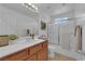 Updated bathroom with vanity, shower, and great lighting at 5653 Mount Athos St, North Las Vegas, NV 89031