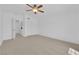 Spacious bedroom with a ceiling fan and closet at 5653 Mount Athos St, North Las Vegas, NV 89031