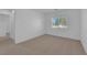 Bedroom featuring neutral carpet, and a window with neighborhood views at 5653 Mount Athos St, North Las Vegas, NV 89031