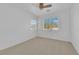 A bright bedroom featuring neutral carpet, and a window with neighborhood views at 5653 Mount Athos St, North Las Vegas, NV 89031