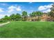 Large green space with healthy lawn and mature trees at 5653 Mount Athos St, North Las Vegas, NV 89031