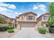 Charming two-story home featuring a two-car garage, manicured landscaping, and a welcoming front porch at 5653 Mount Athos St, North Las Vegas, NV 89031