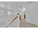Hallway area with decor and a view of a bathroom and staircase to the front door at 5653 Mount Athos St, North Las Vegas, NV 89031