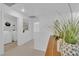 Hallway area with decor and a view of a laundry room at 5653 Mount Athos St, North Las Vegas, NV 89031