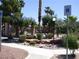 A landscaped common area offers seating and manicured shrubbery for resident enjoyment at 5751 E Hacienda Ave # 137, Las Vegas, NV 89122