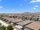 Panoramic aerial view of the residential area with mountain views in the distance at 5936 Bruselas St, Las Vegas, NV 89113