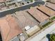 Drone shot shows the property's backyard with patio and the surrounding community at 5936 Bruselas St, Las Vegas, NV 89113