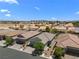 Wide aerial view of the property and neighborhood, mountains in the distance at 5936 Bruselas St, Las Vegas, NV 89113