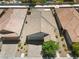 An aerial view showcases the home's tile roof, well-kept landscaping, and the neighborhood at 5936 Bruselas St, Las Vegas, NV 89113