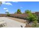 Large backyard area with block wall, drought tolerant landscape, and patio at 5936 Bruselas St, Las Vegas, NV 89113