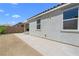 Property featuring a modern, hardscaped backyard perfect for entertaining at 5936 Bruselas St, Las Vegas, NV 89113