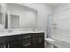 Bathroom with double vanity, bath tub and shower combo at 5936 Bruselas St, Las Vegas, NV 89113